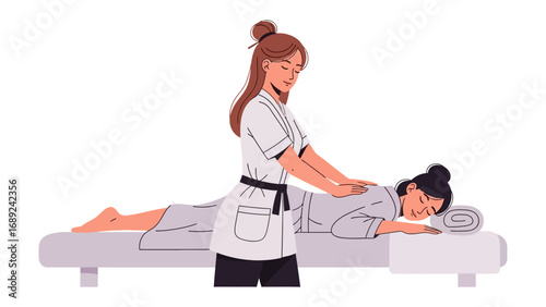 A skilled therapist gently massages a patient s back on a massage table in a clean well lit room