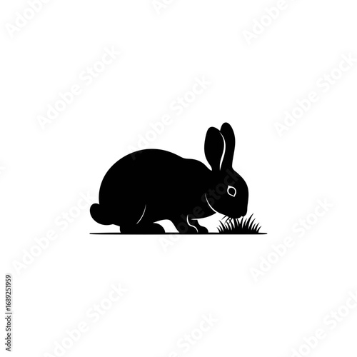 Black rabbit silhouette eating grass isolated on white background silhouette