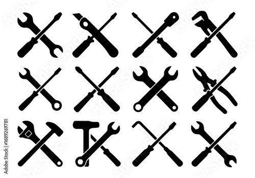 Black silhouette tool icons in crossed arrangement for construction and repair