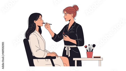 Professional makeup artist applying cosmetics to a client in a salon setting with brushes and tools displayed