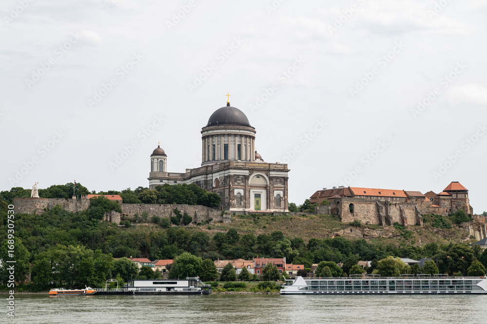 Fototapeta premium The majestic Esztergom Basilica rising on a hill along the banks of the Danube River. Historical and natural beauties of Hungary.