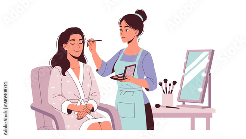 Professional makeup artist applying cosmetics to a client in a salon setting with mirror and brushes