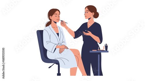 Professional makeup artist applying cosmetics to a client in a white robe with a makeup station