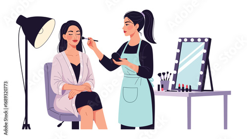 Professional makeup artist applying cosmetics to a model in a studio setting with lighting and mirror
