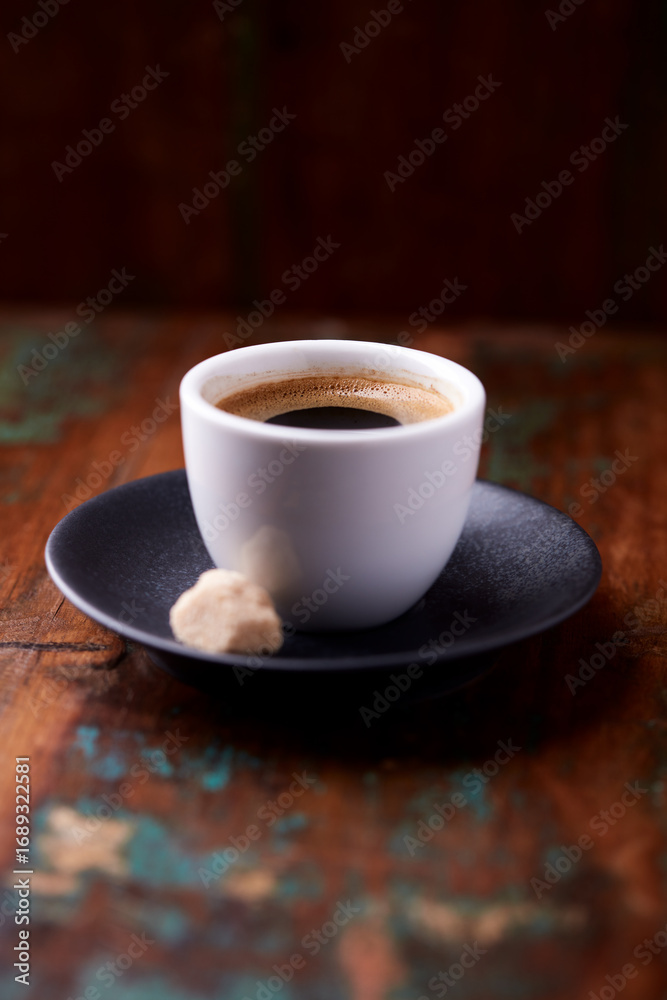 Obraz premium Cup of coffee on rustic wooden background. Soft focus. Copy space 