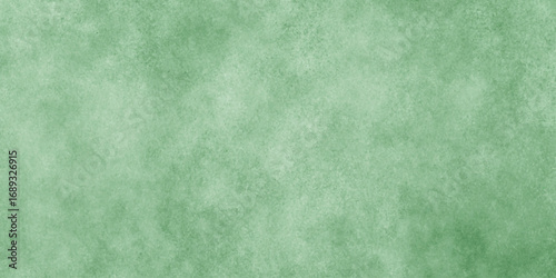 Abstract Elegant dark green background with mottled vintage texture in old fancy background design, texture of colored parchment paper.	