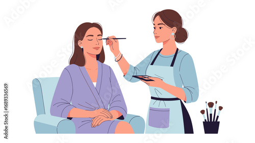 Professional makeup artist applying eyeshadow to a client sitting in a chair wearing a robe