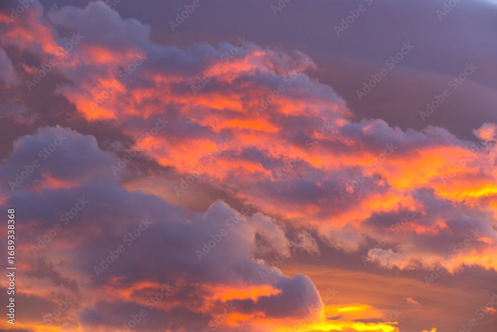 Fototapeta premium Burning dramatic colorful clouds in beautiful sunset