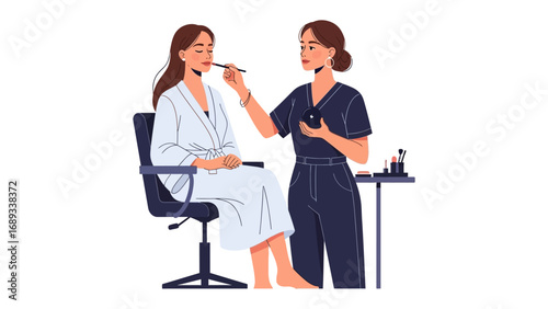 Professional makeup artist applying cosmetics to a seated client in a salon or studio setting