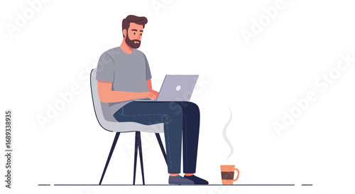 Man Working on Laptop with Coffee Cup Beside Him.