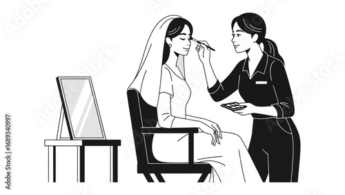 Bridal makeup artist applying cosmetics to a bride wearing a veil and traditional attire in a studio setting