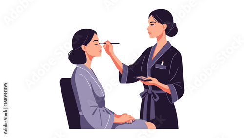 Professional makeup artist applying cosmetics to a client s face with a brush in a studio setting