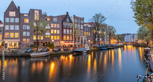 Photography Canal in the Old Town of Amsterdam in the evening time.