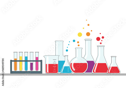 Collection of various scientific glassware containing colorful chemical solutions in a laboratory setting