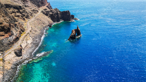 Roque de Bonanza is one of the symbols of El Hierro island and its natives. Huge Rock sticking out of the water on the las Almorranas beach. El Hierro, Canary islands Spain.	
