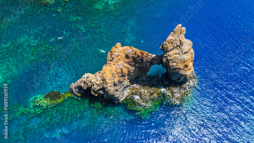 Roque de Bonanza is one of the symbols of El Hierro island and its natives. Huge Rock sticking out of the water on the las Almorranas beach. El Hierro, Canary islands Spain.	
