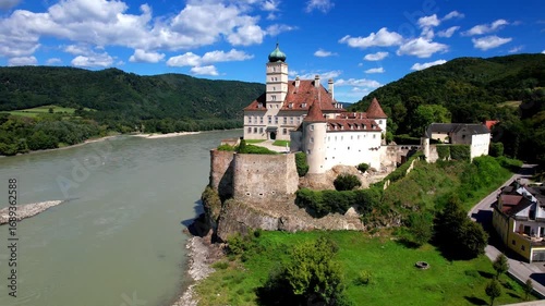 Schonbuhel Castle Austria 4k drone footage of Wachau Valley Danube River cruise. Aerial wide view of historic Schonbuhel Aggsbach landmark castle building architecture Lower Austria travel b-roll