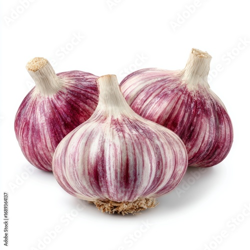 Three vibrant garlic bulbs, presenting their organic goodness. These bulbs offer a healthy, raw, cooking ingredient