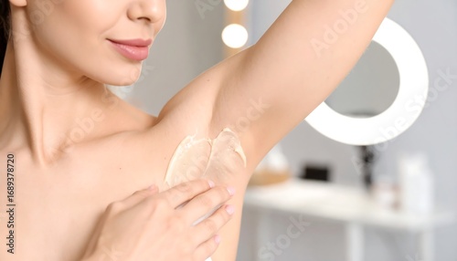 Woman applying underarm cream