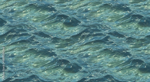 Aerial view showcasing a vast expanse of ocean water with gentle waves and shimmering sunlight effects