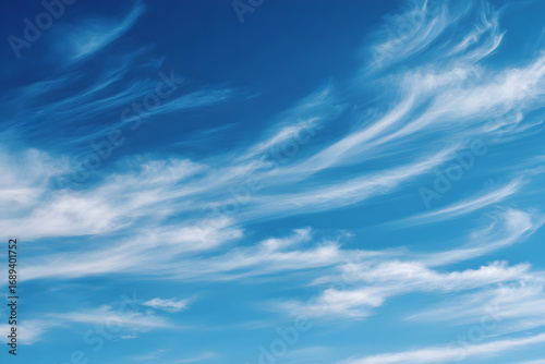 Beautiful blue sky with wispy clouds creates a serene and peaceful atmosphere today