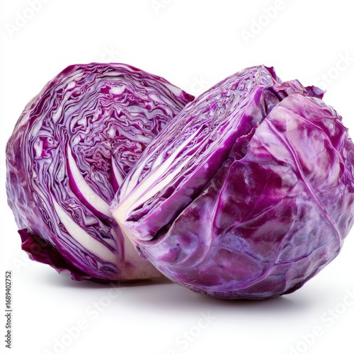 A freshly cut red cabbage, showcasing the vibrant and layered interior. The cabbage has been cut in half