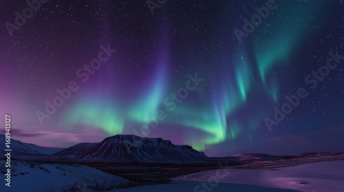 Wallpaper Mural A majestic landscape under a starry night sky with flowing curtains of green and purple aurora over a mountain range. Torontodigital.ca