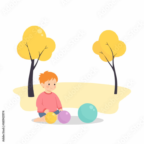 Young boy playing with colorful balls in a park during autumn  