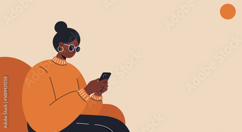 Modern African American woman relaxes while engaging with her smartphone for communication, social media, or online activities. Ideal for lifestyle, technology, or business concepts.