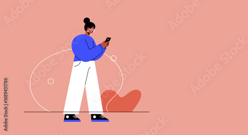 A stylish young woman engrossed in her smartphone, connecting digitally. Represents communication, social media, and modern technology use in daily life.