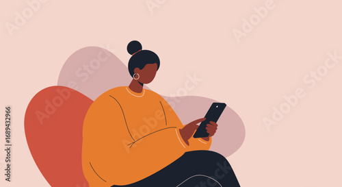 A modern, diverse woman relaxes while using her smartphone, engaging with social media, messaging, or online content. Represents connection, digital lifestyle, communication, and technology use.
