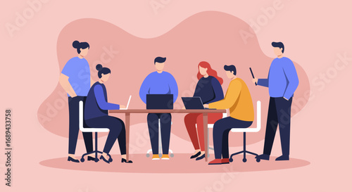 A diverse team collaborates in a modern office, working together on laptops during a productive business meeting. Ideal for concepts of teamwork, strategy, and innovation.