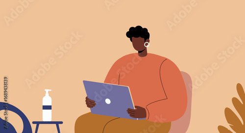 Person works remotely on a laptop in a modern home office, featuring hand sanitizer. Perfect for remote work, technology, hygiene, and modern lifestyle themes.
