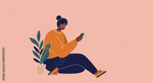 Woman comfortably sitting on the floor, engaged with her smartphone. Illustrates modern digital life, communication, and casual technology use for business or leisure.
