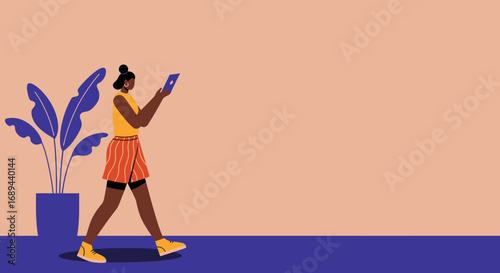 Modern young woman walks casually while using a digital tablet, reflecting connectivity, leisure, and a modern lifestyle. Ideal for technology or daily life concepts.