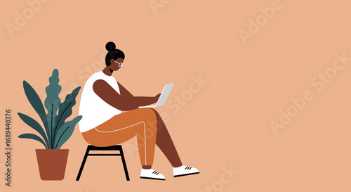 Young person using laptop for remote work or online study, reflecting digital lifestyle, freelancing, and connectivity from a cozy space.