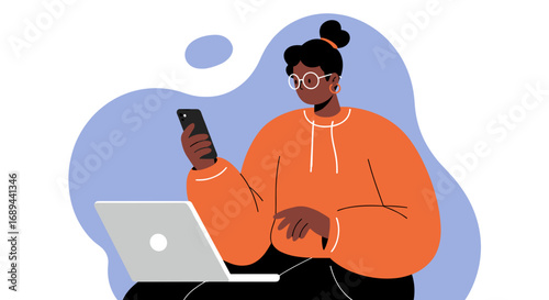 A focused woman uses her smartphone and laptop simultaneously, illustrating modern multitasking, digital communication, and remote productivity for business or personal use.