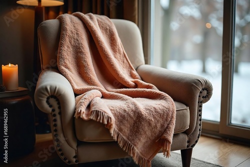 Cozy, soft blanket draped over a plush armchair, inviting warmth and relaxation on a chilly day Perfect for autumn or winter scenes , room, soft