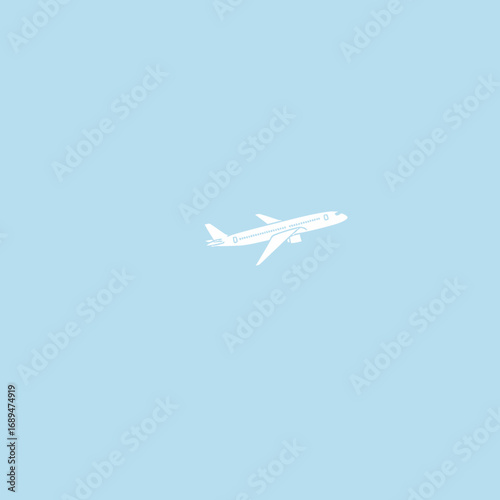 White Airplane in Light Blue Sky