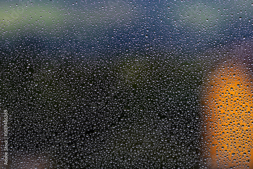 Raindrops on the window glass.