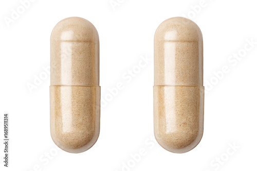 Two light beige capsules,  close-up,  front view.  Transparent  shell,  filled  with  tan  powder.  Isolated on black