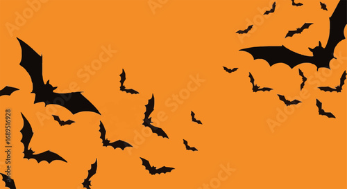 Spooky Halloween background with a swarm of flying black bats on a vibrant orange backdrop. Creepy design element for autumn celebrations.