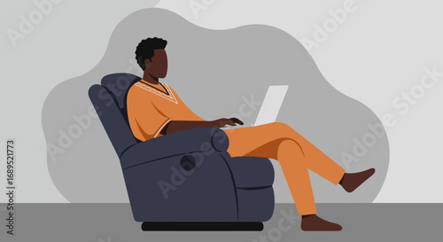 A man relaxes in a recliner chair while working on his laptop, embodying remote productivity and comfortable lifestyle. Ideal for concepts of work-life balance, technology, and home office.