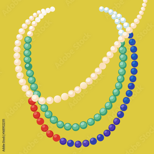 Colorful pearl necklaces on a yellow background