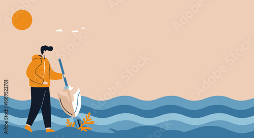 Man in an orange hoodie with a shovel in wavy blue water under a warm sun, symbolizing environmental cleanup and conservation efforts.