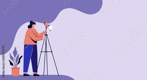 Creative professional setting up a studio light on a tripod for photography or video production. Ideal for concepts of content creation, media, and artistic work.