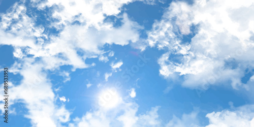 Fluffy white clouds drift across a beautiful blue sky on a bright summer day.