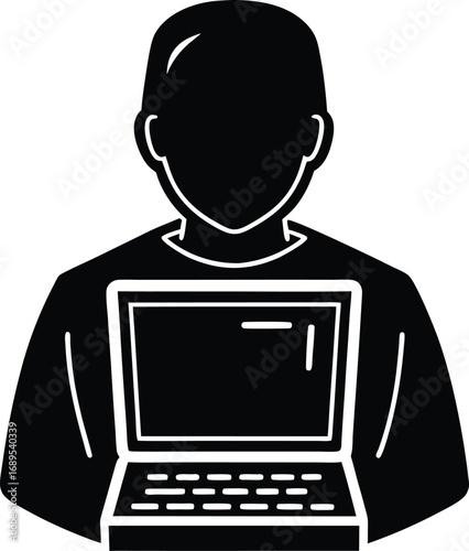 Silhouette of a programmer working on a laptop computer
