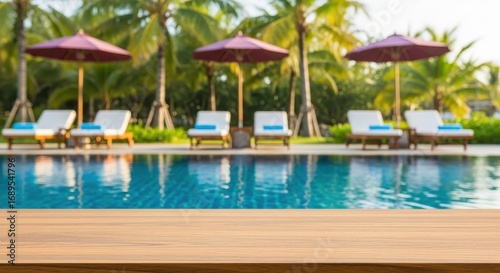 Serene Tropical Resort Swimming Pool With Lounge Chairs Umbrellas And Palm Trees In The Background