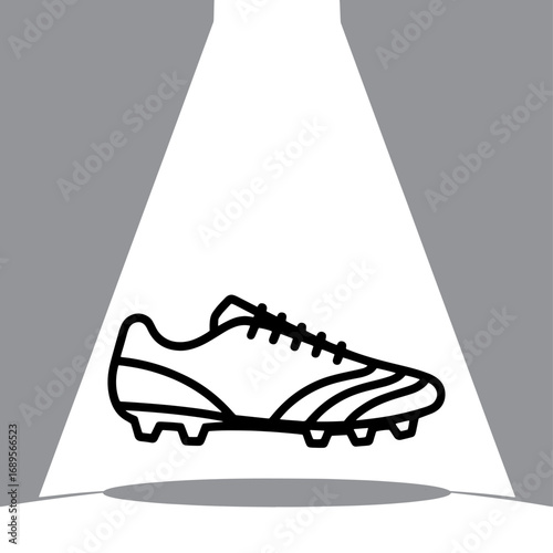 Spotlit Football Boot a Symbol of Athletic Prowess and Sporting Goods Excellence in Dynamic Black and White